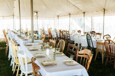 This Blue Mountains wedding's reception was in a tent with mismatched vintage second-hand chairs at the tables