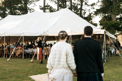 The bride and groom return to their wedding tent at their Blue Mountains wedding