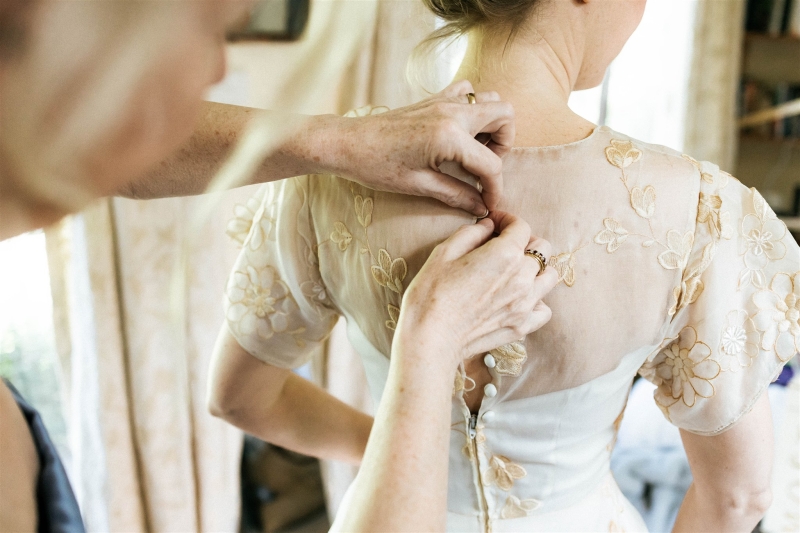 A bride and groom get ready together with their best friends